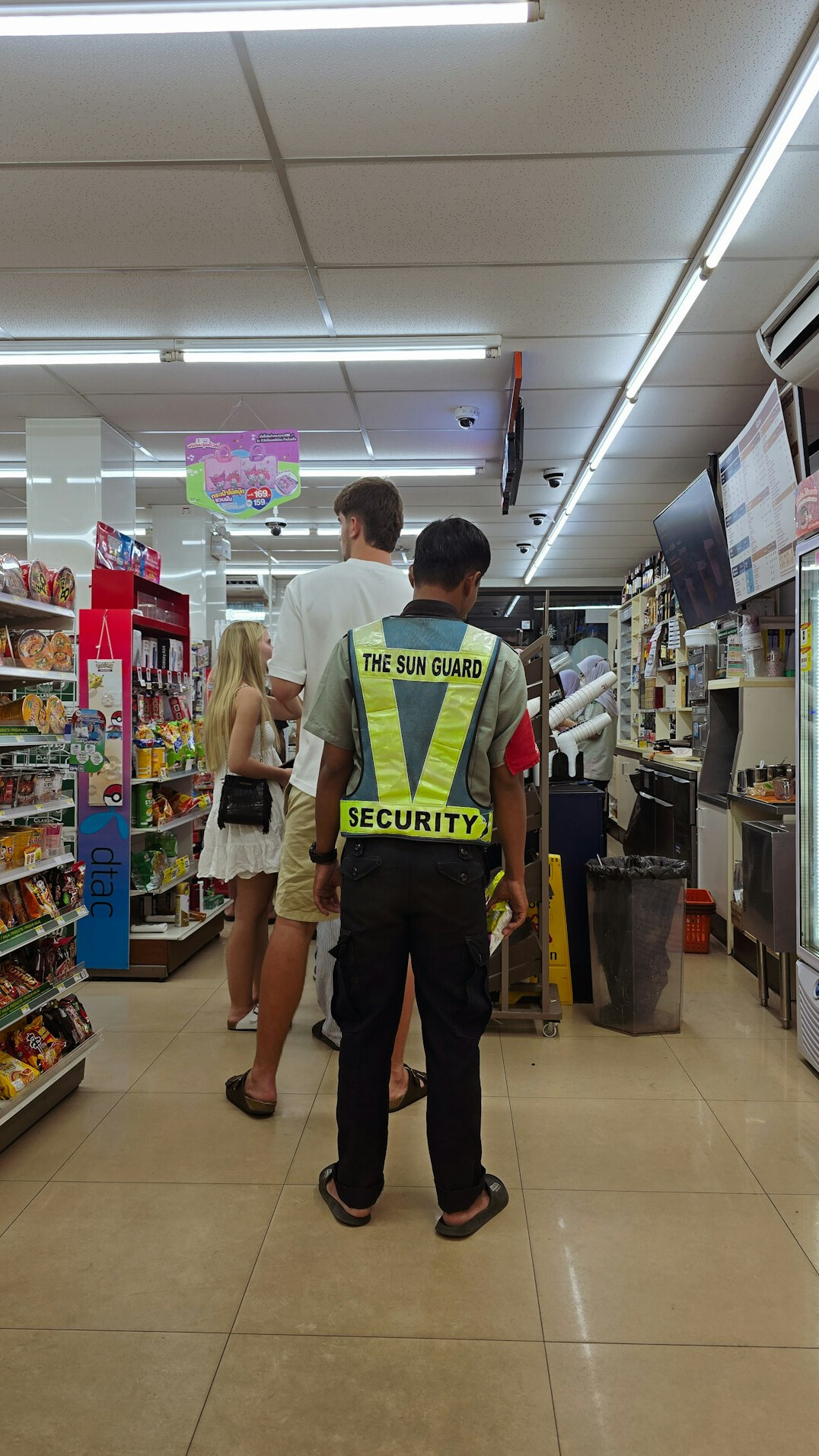 store security guard watching customers